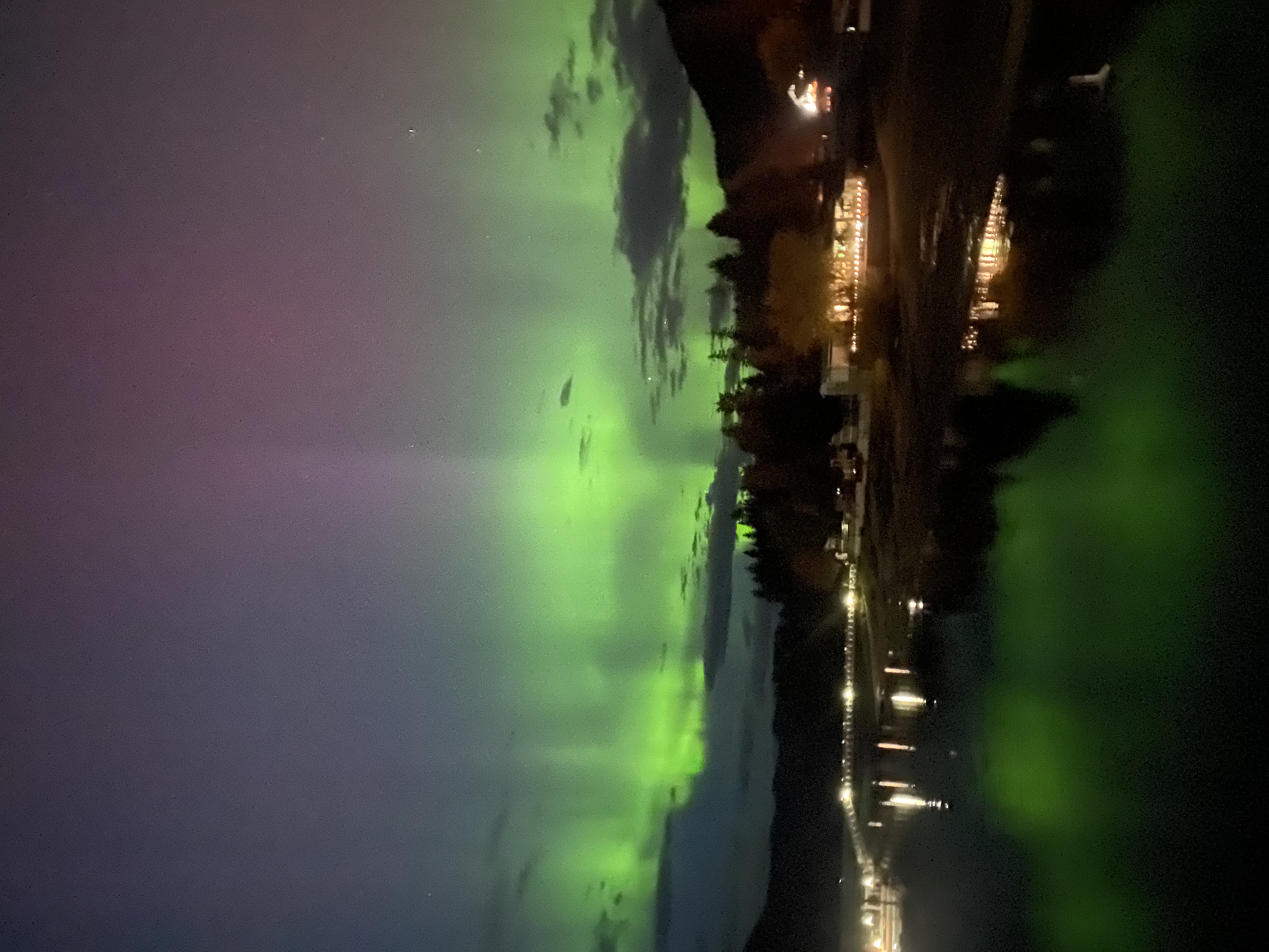 Northern Lights reflected over Mara Lake near Willow Shores Resort